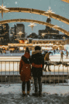 Couple-watching-many-ice-skaters