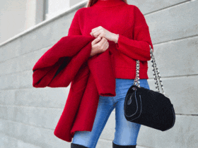 Woman-wearing-red-sweater-with-blue-skinny-jeans.