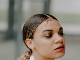 chic outfit and slicked back ponytail