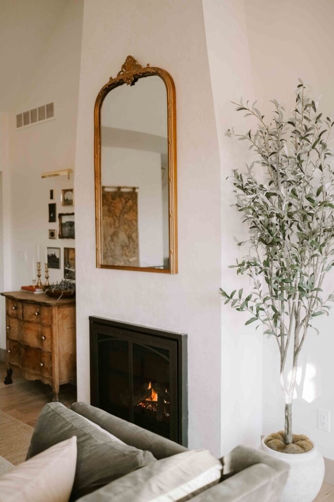 european living room with a tapered plaster fireplace