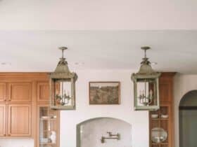 oversized vintage lanterns over a kitchen island european kitchen