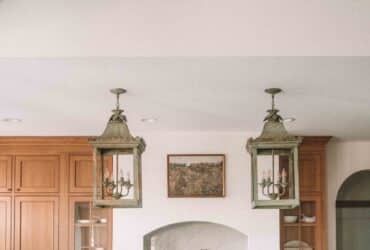 oversized vintage lanterns over a kitchen island european kitchen