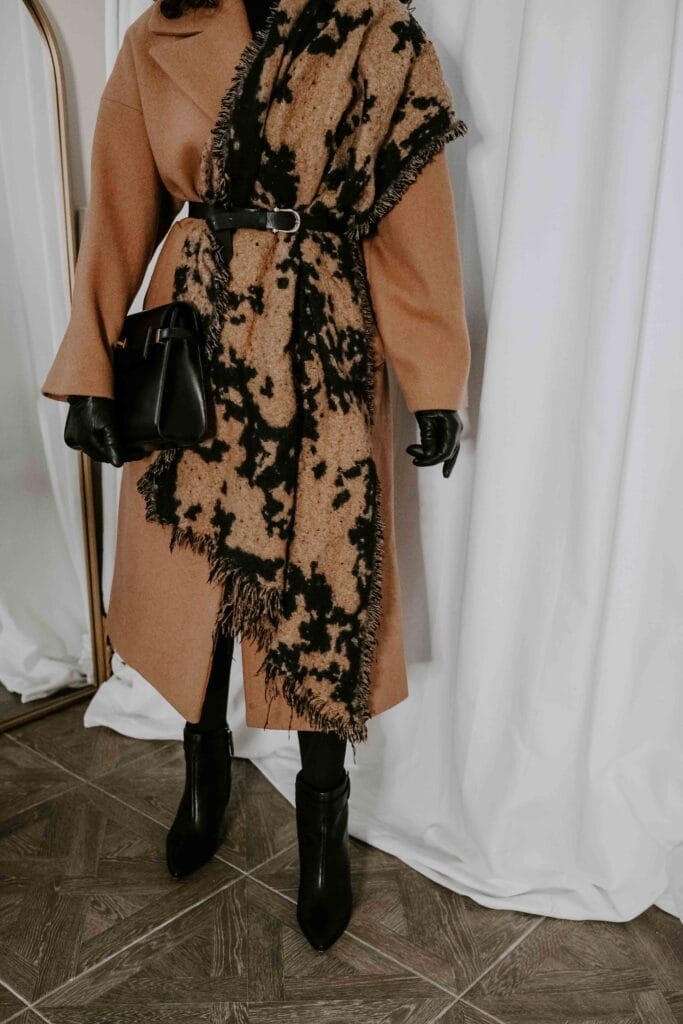 belted scarf over camel wool coat